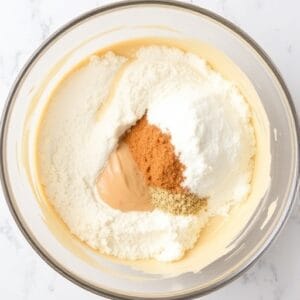 Add Dry Ingredients In a separate bowl, mix together flour, baking powder,