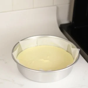 Preheat your oven to 350°F (175°C). Grease and flour two 9-inch round cake pans, or line them with parchment paper for easy removal after baking.