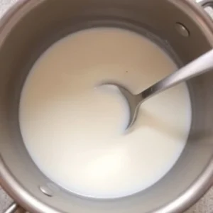 In a medium saucepan, combine the whole milk and heavy cream. Heat over medium-low, stirring occasionally until warmed but not boiling.