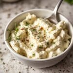 mixing herbs into cottage cheese