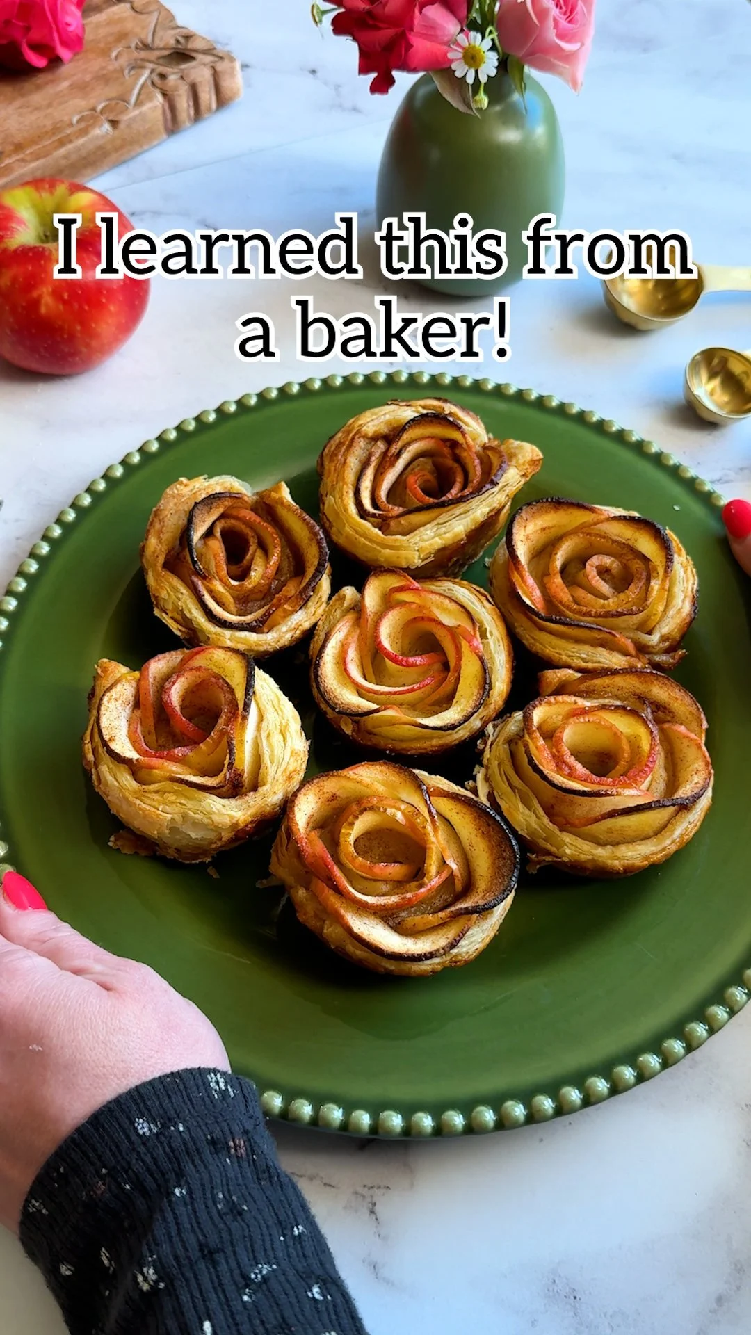Beautifully arranged apple rose tarts on a plate, a perfect dessert for any occasion.