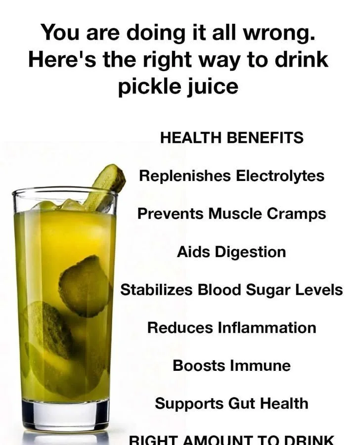 A glass of pickle juice with fresh pickles, showcasing the best way to enjoy it.