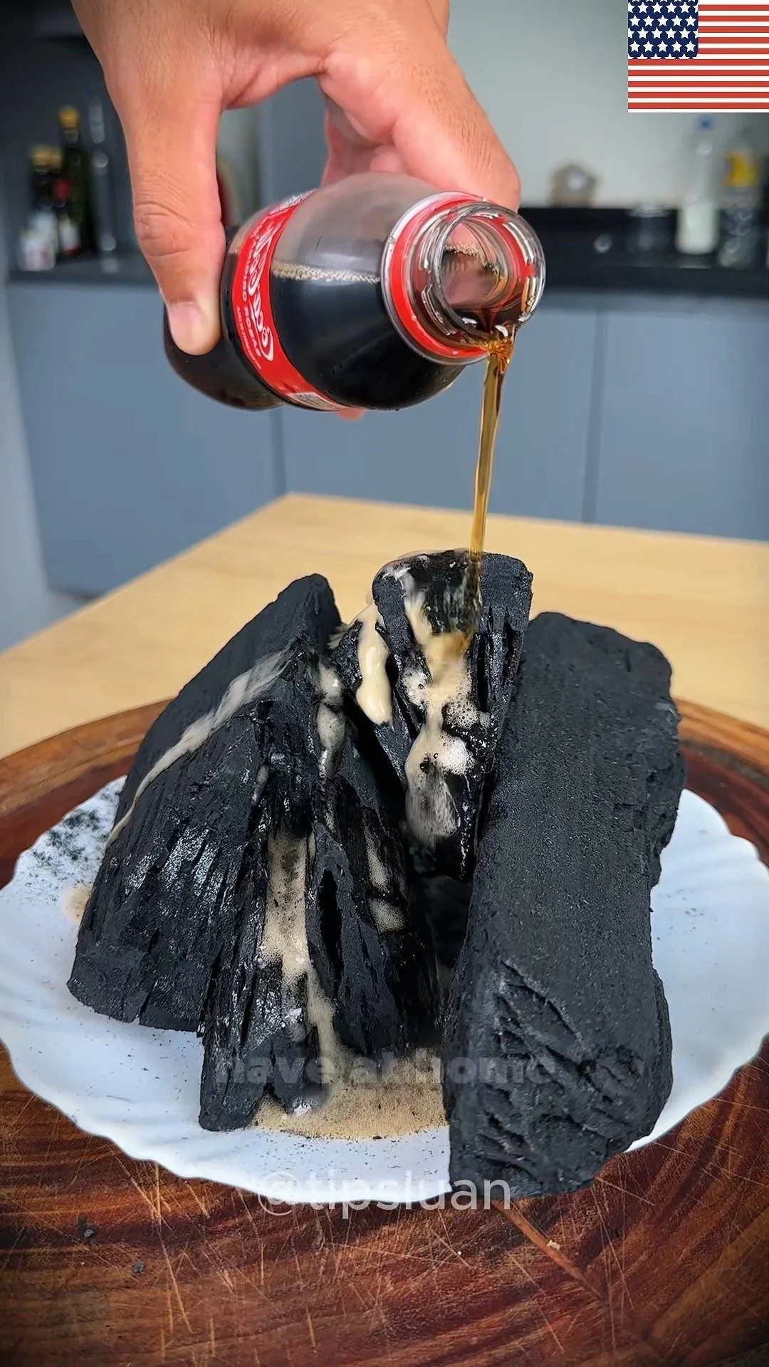 Coca-Cola poured over charcoal for grilling and barbecue purposes.