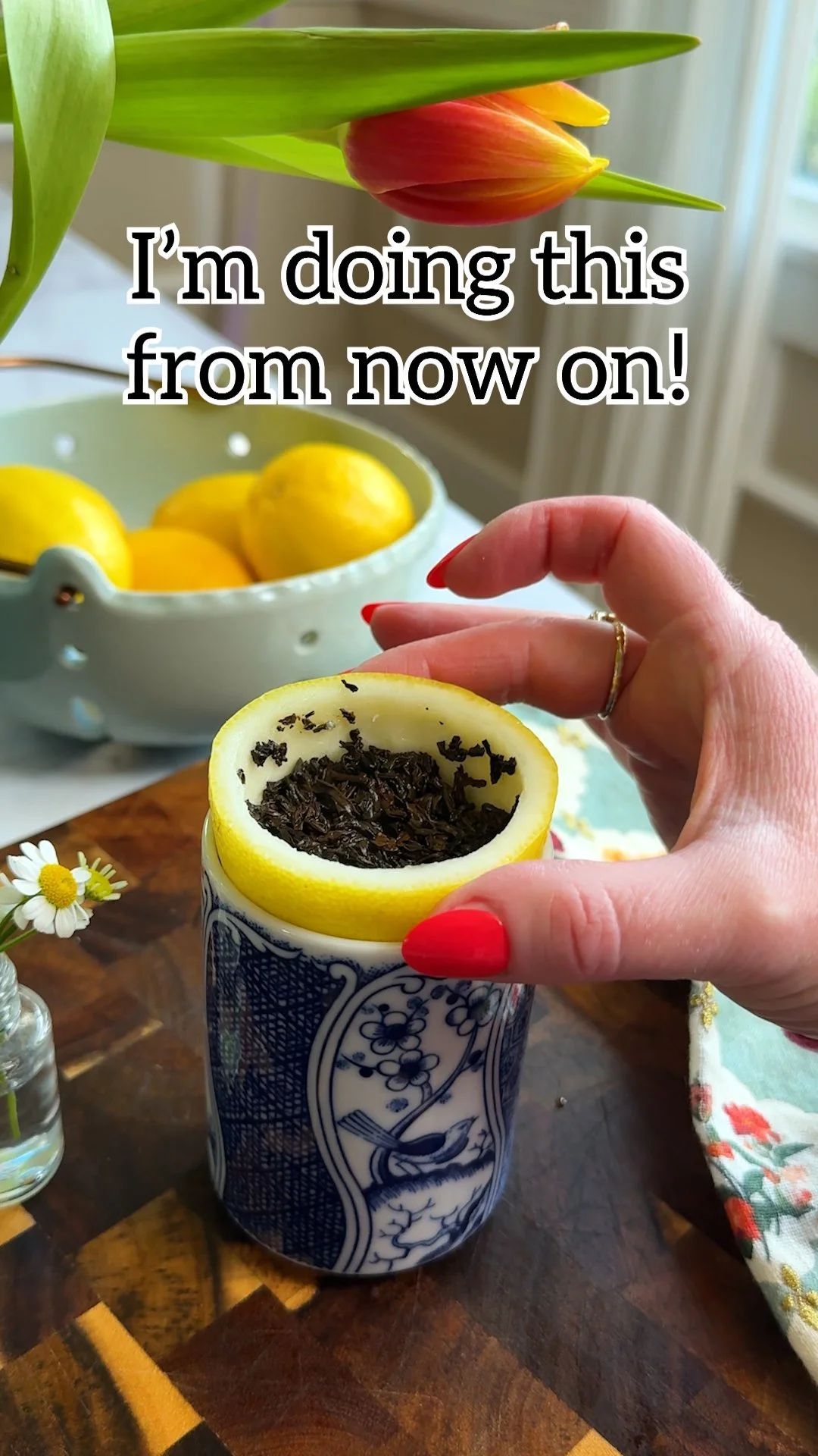 A cup of loose leaf tea infused with fresh lemon peel for a zesty flavor.